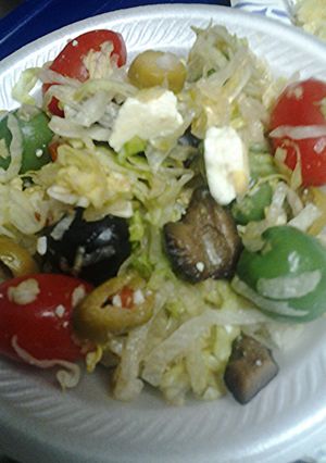 A picture of Lettuce olive and tomato salad.