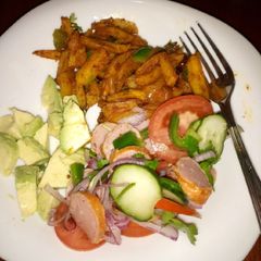 A picture of Chips masala and kachumbari.
