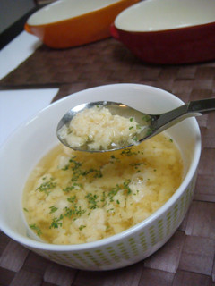 A picture of Roma-style Consomme Soup with Cheese.