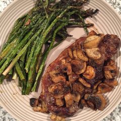 A picture of NY Strip Steak, Asparagus And Mushrooms.