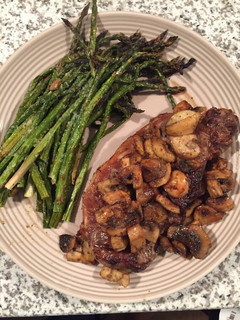 A picture of NY Strip Steak, Asparagus And Mushrooms.