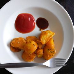 A picture of Viazi Karai with Dhania and seasonings.