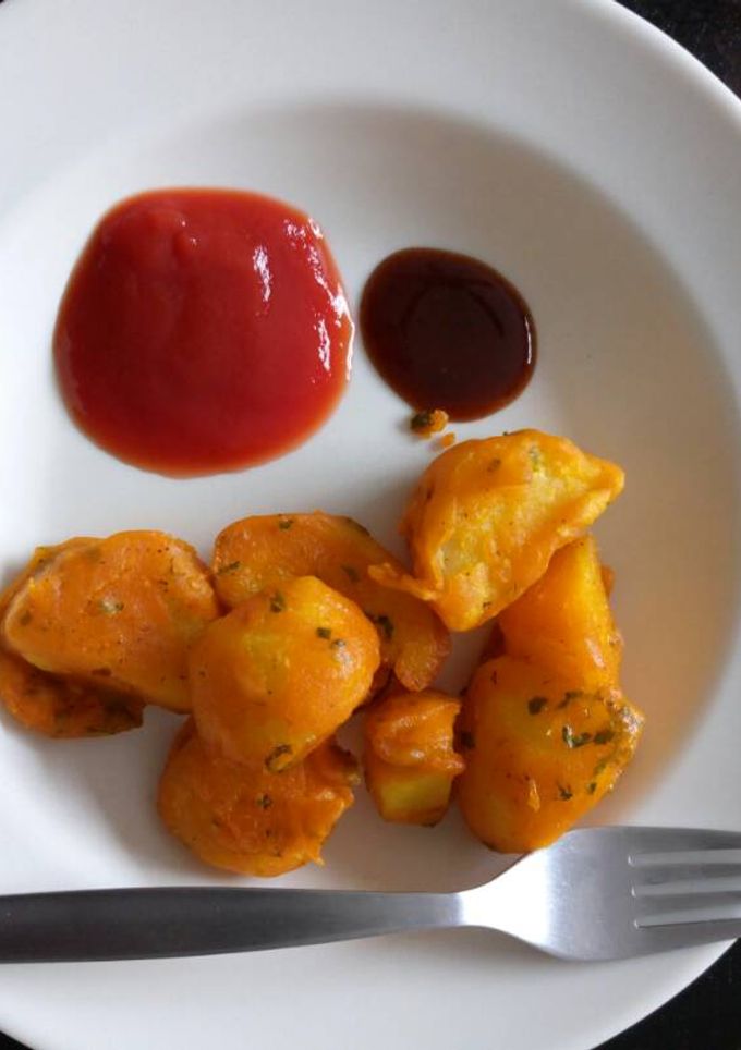A picture of Viazi Karai with Dhania and seasonings.