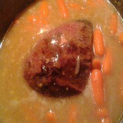 A picture of Beef roast and carrots.