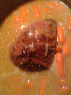 A picture of Beef roast and carrots.