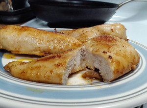 A picture of Seasoned, buttered boneless skinless chicken breast..