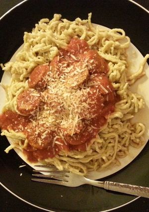 A picture of Spicy jalapeno pasta with french classic sauce and sausage.
