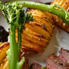 Hassleback New Potatoes With Garlic Butter & Thyme A picture of Hassleback New Potatoes With Garlic Butter & Thyme.