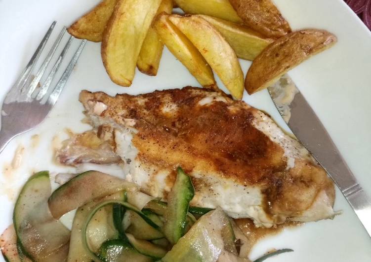 Deep fried potato wedges with pan fried red snapper and cucumber in balsamic vinegar