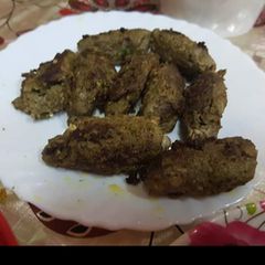 A picture of Mutton Seekh kebab in pan.