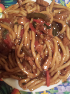 A picture of Honey ginger garlic pork udon..