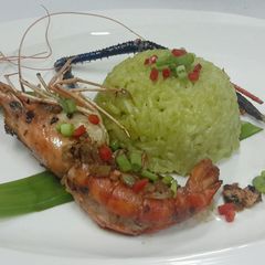 Thai Jasmine Rice Cooked with Aroma Pandan Leaves Serve with Garlic and Pepper Prawn A picture of Thai Jasmine Rice Cooked with Aroma Pandan Leaves Serve with Garlic and Pepper Prawn.