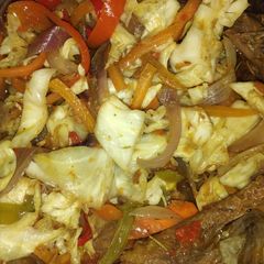 A picture of Chicken and vegetable stir fry.