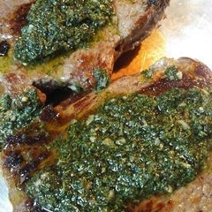 A picture of Buttered Sirloin Steak with Chimichurri Sauce.