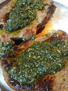 A picture of Buttered Sirloin Steak with Chimichurri Sauce.