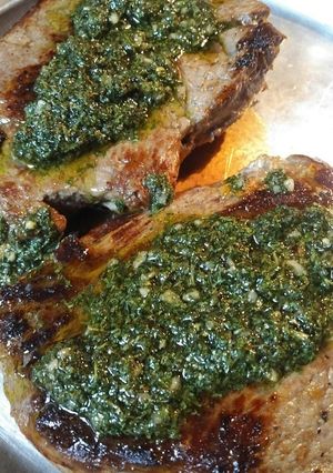 A picture of Buttered Sirloin Steak with Chimichurri Sauce.