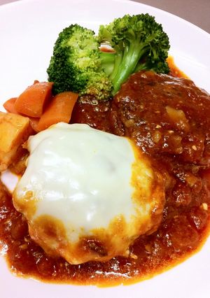 A picture of Light and Fluffy Tofu Hamburger Steaks Simmered in Sauce.