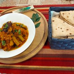 A picture of Flavourful and nutritious drumstick and tomato sabzi paired with roti for dinner.