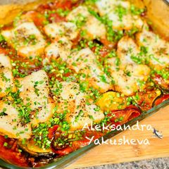 A picture of Cod with vegetables in the oven.