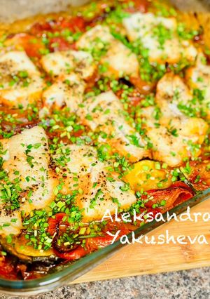 A picture of Cod with vegetables in the oven.