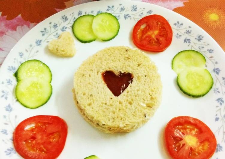 Whole grain bread with tomato ketchup and tomato,cucumber slices