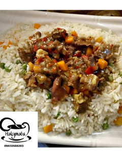 A picture of Vegetable rice with beef soup.