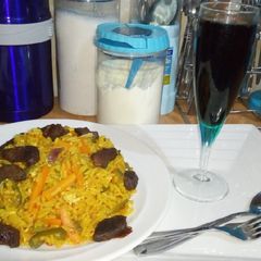 A picture of Jallof rice with grilled meat.