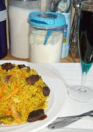 A picture of Jallof rice with grilled meat.
