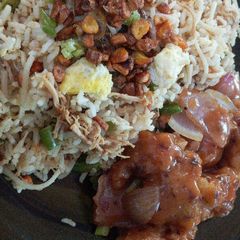 A picture of Burnt garlic mixed chicken rice with manchurian gravy.