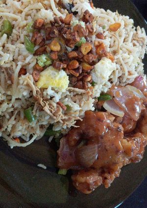 A picture of Burnt garlic mixed chicken rice with manchurian gravy.