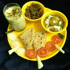 A picture of Aloo akbari,masala bhindi with coriander buttermilk full platter.