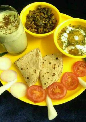 A picture of Aloo akbari,masala bhindi with coriander buttermilk full platter.