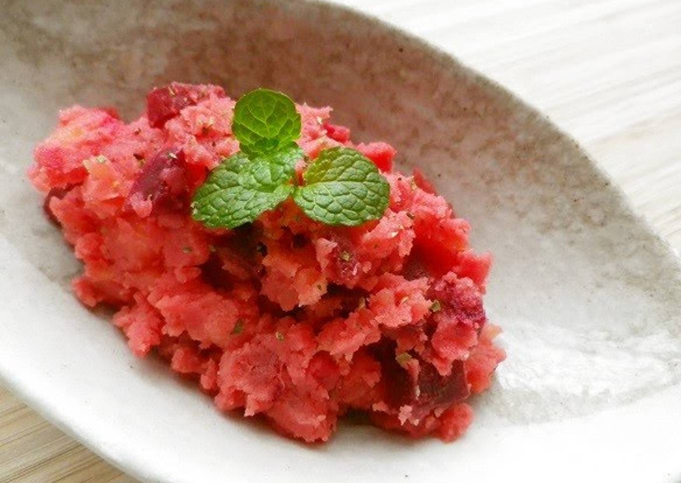 Potato salad in the microwave with bright red beets