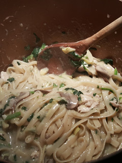 A picture of One pot spinach artichoke pasta with chicken.