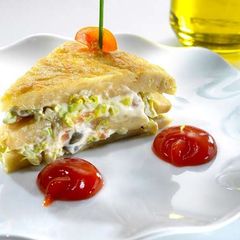A picture of Pinchos of Spanish omelette stuffed with smoked salmon salad.