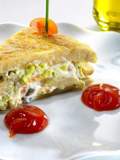 A picture of Pinchos of Spanish omelette stuffed with smoked salmon salad.