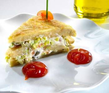 Fast Cooking Methods Pinchos of Spanish omelette stuffed with smoked salmon salad Delicious Nutritious