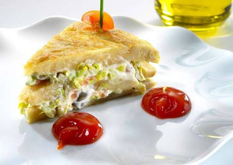 Pinchos of Spanish omelette stuffed with smoked salmon salad