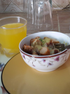 A picture of Cheesy sausage and kabab with orange juice.