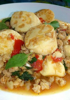 A picture of Stir-Fried Pork with Egg Tofu and Basil.