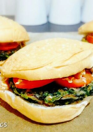 A picture of Spinach Burger with pork and beans.