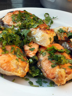 A picture of Salmon with olive oil & coriander.