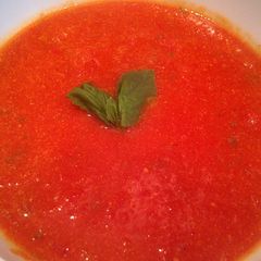 A picture of tomato, basil, & roasted red pepper soup.