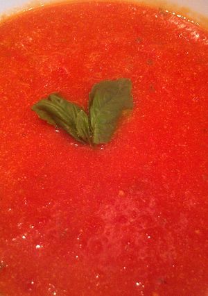 A picture of tomato, basil, & roasted red pepper soup.