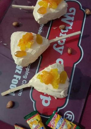A picture of Eggless mango cake popsicles.