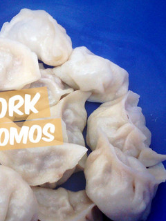 A picture of DARJEELING PORK MOMOS.