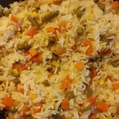 A picture of Rice with mix vegetables.