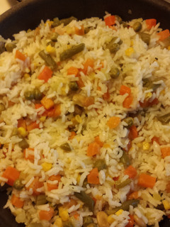 A picture of Rice with mix vegetables.