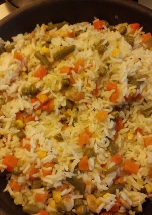 A picture of Rice with mix vegetables.
