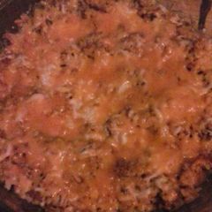 A picture of Cheesy chorizo Spanish rice bake.